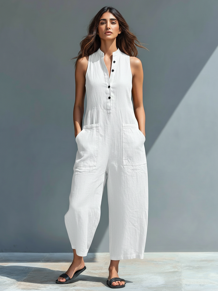 Minimalistisk damejumpsuit i hørblanding med knaplukning og stand-up-krave, ærmeløs og løs MDZ2725A5Y