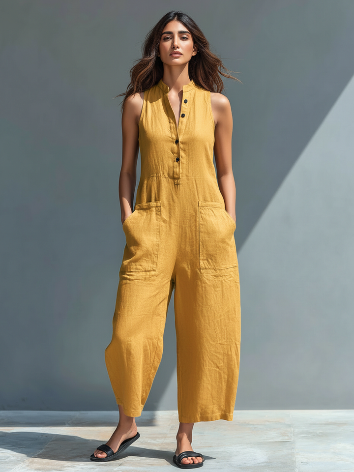 Minimalistisk damejumpsuit i hørblanding med knaplukning og stand-up-krave, ærmeløs og løs MDZ2725A5Y