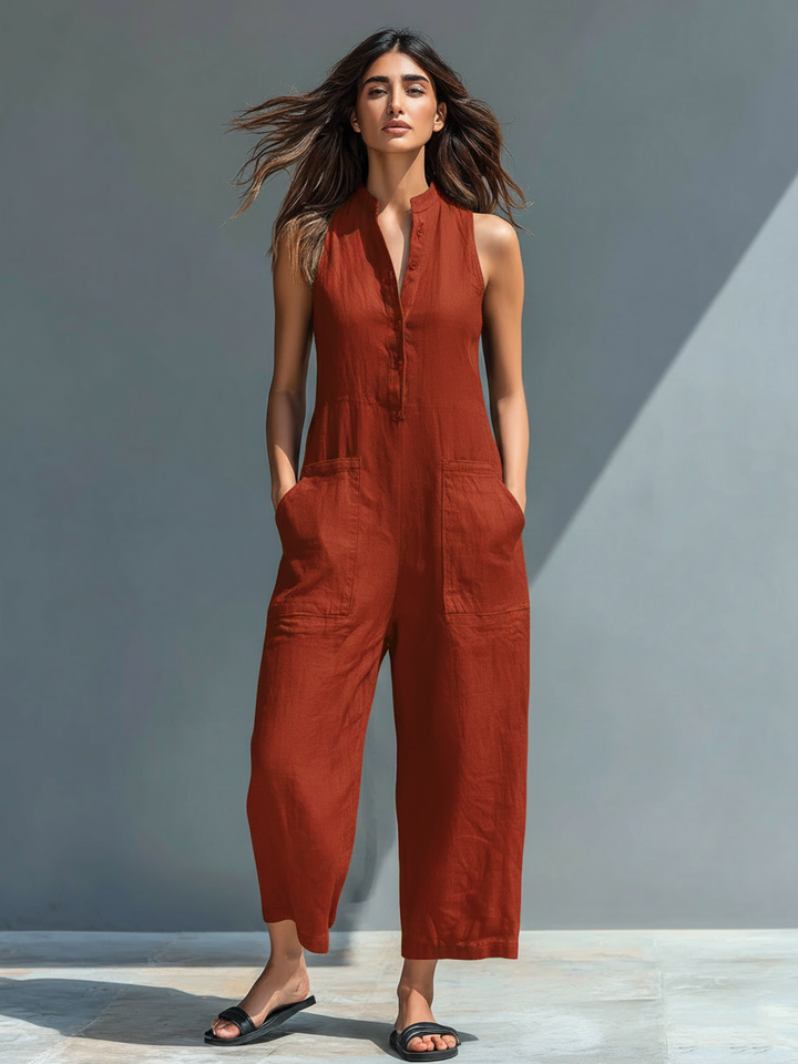 Minimalistisk damejumpsuit i hørblanding med knaplukning og stand-up-krave, ærmeløs og løs MDZ2725A5Y