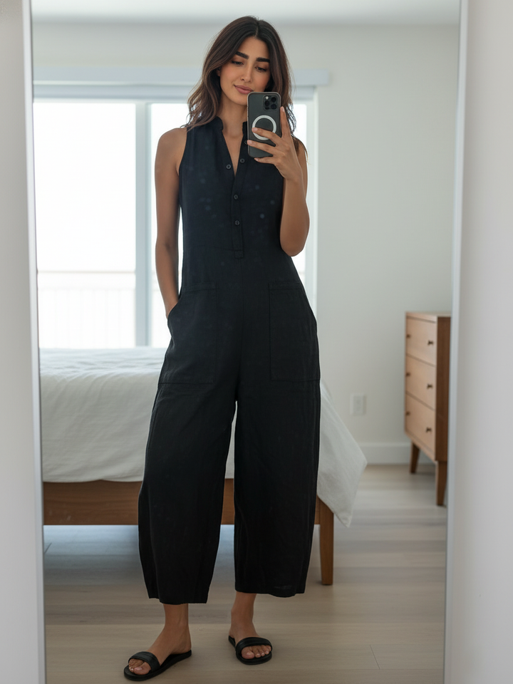 Minimalistisk damejumpsuit i hørblanding med knaplukning og stand-up-krave, ærmeløs og løs MDZ2725A5Y